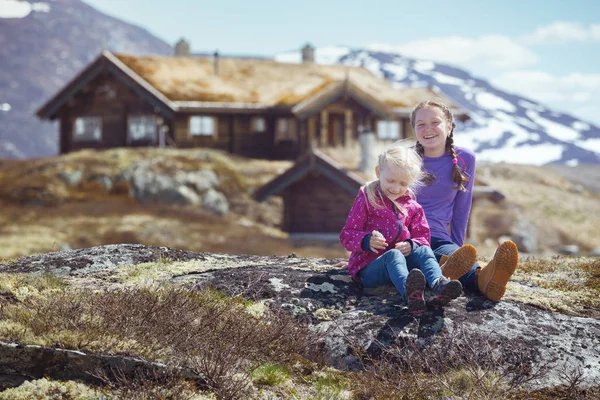 Child Smiling Girl Hiker Sitting Background Old Traditional Wooden Houses — Stock Photo, Image