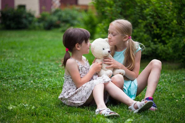 Little Pretty Girls Girlfriends Sitting Lawn His Toy Teddy Bear — Stock Photo, Image