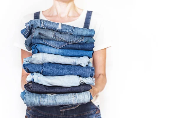 Girl Holds Stack Jeans Her Hands Cleaning Closet — Stock Photo, Image