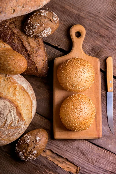 Different Fresh Bread Buns Wooden Tabl — Stock Photo, Image
