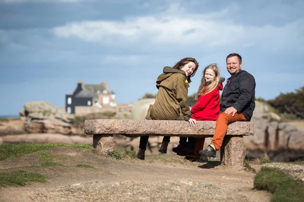 Happy Dad Two Daughters Sits Bench Sea Shore Tregastel Brittany — Stock Photo, Image
