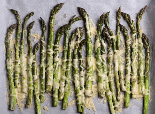 Asparagus with cheese baked in the oven — Stock Photo, Image