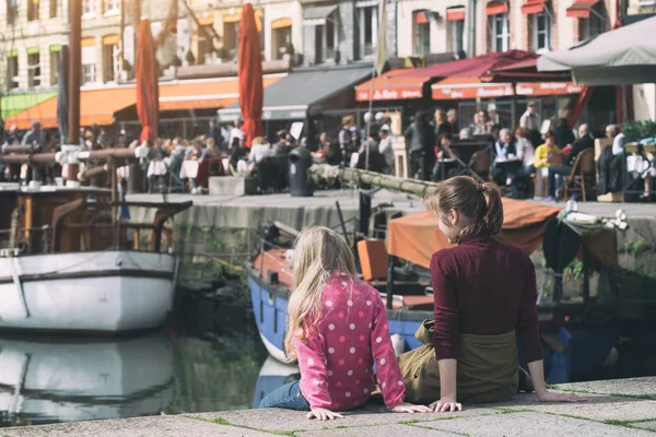 Girls sitting on background famous French city Honfleur — Stock Photo, Image