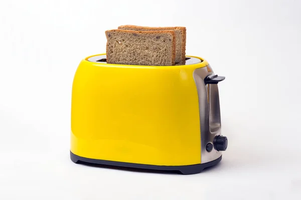 Gelber Toaster auf weißem Hintergrund — Stockfoto