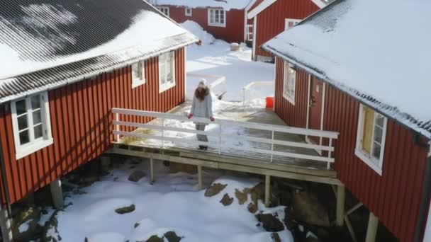 Girl Standing Next Traditional Multicolored Wooden Fishing House Rorbu Sea — стоковое видео