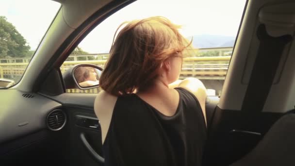 Girl Traveling Car Enjoying Freedom Breeze Her Hair Opened Window — Stock Video