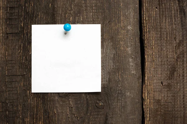 Blank sheet for notes on wooden background — Stock Photo, Image