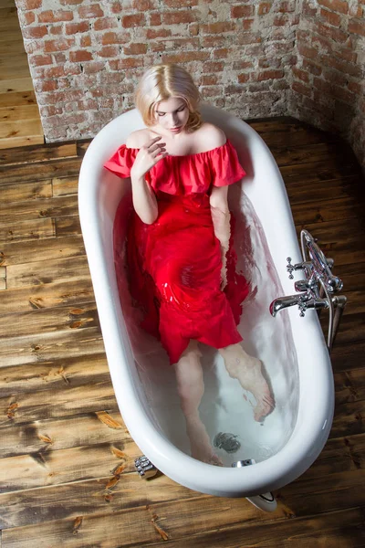 Blonde Long Red Dress Lying Bath Water — Stock Photo, Image