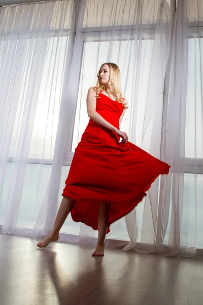 Beautiful Blonde Red Dress Dancing Window Background — Stock Photo, Image
