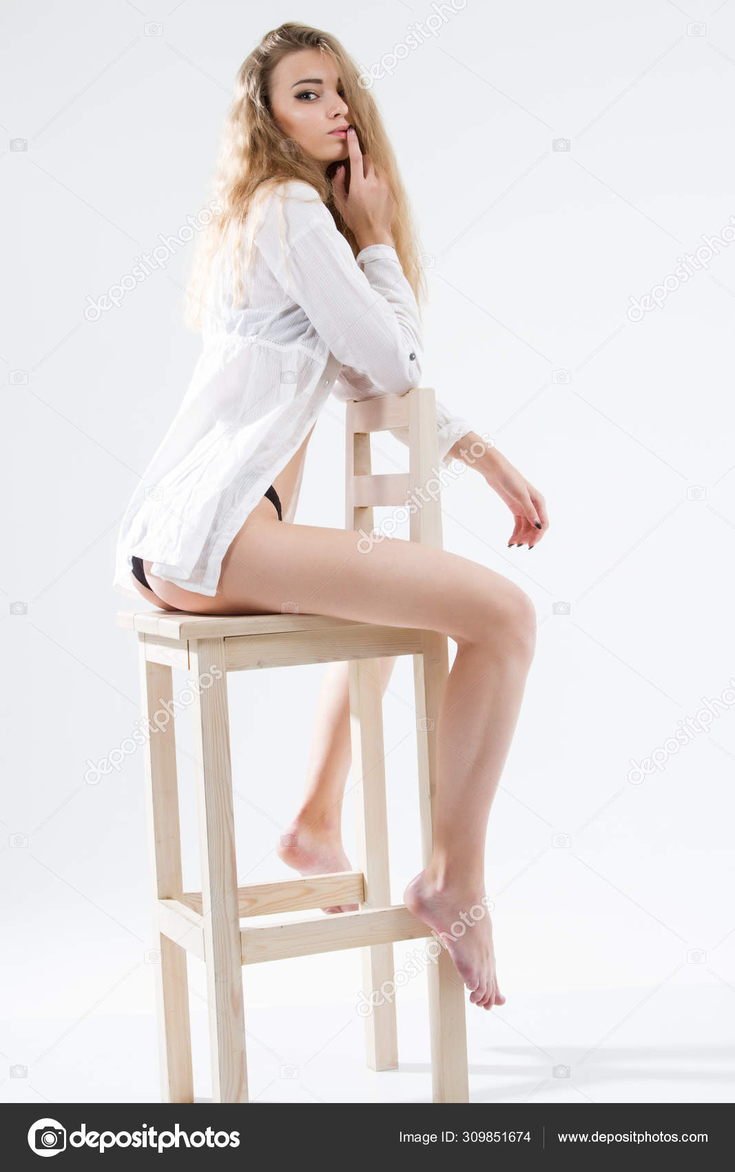 https://st4.depositphotos.com/1003646/30985/i/1600/depositphotos_309851674-stock-photo-young-girl-posing-white-men.jpg