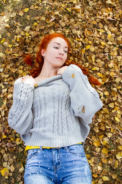 Young Red Haired Girl Lies Yellow Autumn Foliage — Stock Photo, Image