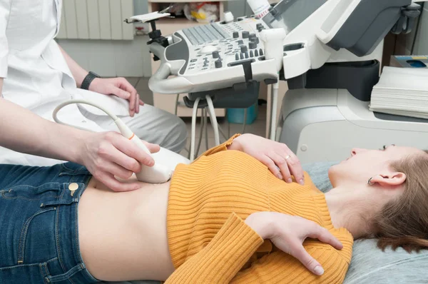 Abdominal ultrasound scan of a woman closeup