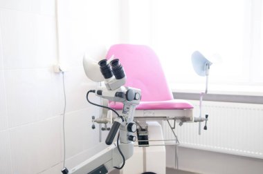 Gynecologist room with a colposcope clipart