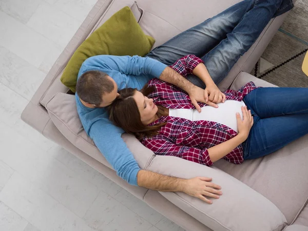 Top View Happy Pregnant Couple Relaxing Sofa Couch Home — Stock Photo, Image