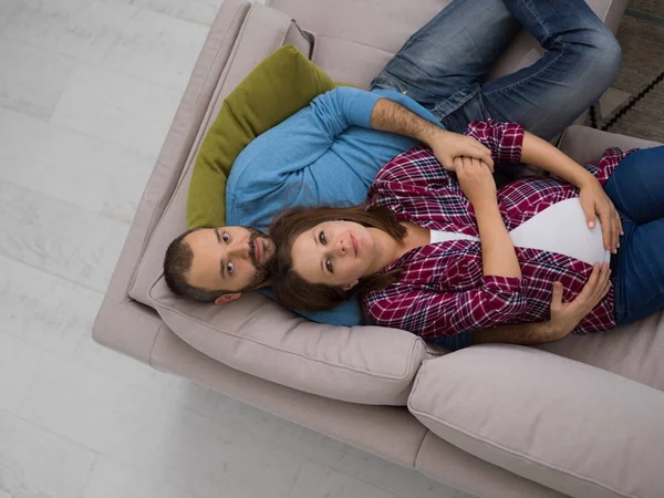 Top View Happy Pregnant Couple Relaxing Sofa Couch Home — Stock Photo, Image