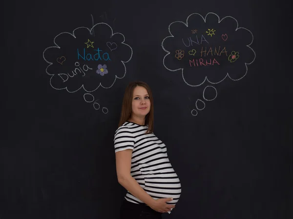 Young Pregnant Woman Thinking Names Her Unborn Baby Writing Them — Stock Photo, Image