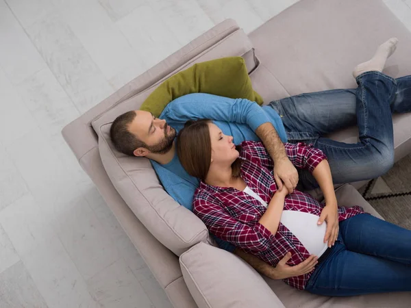 Top View Happy Pregnant Couple Relaxing Sofa Couch Home — Stock Photo, Image