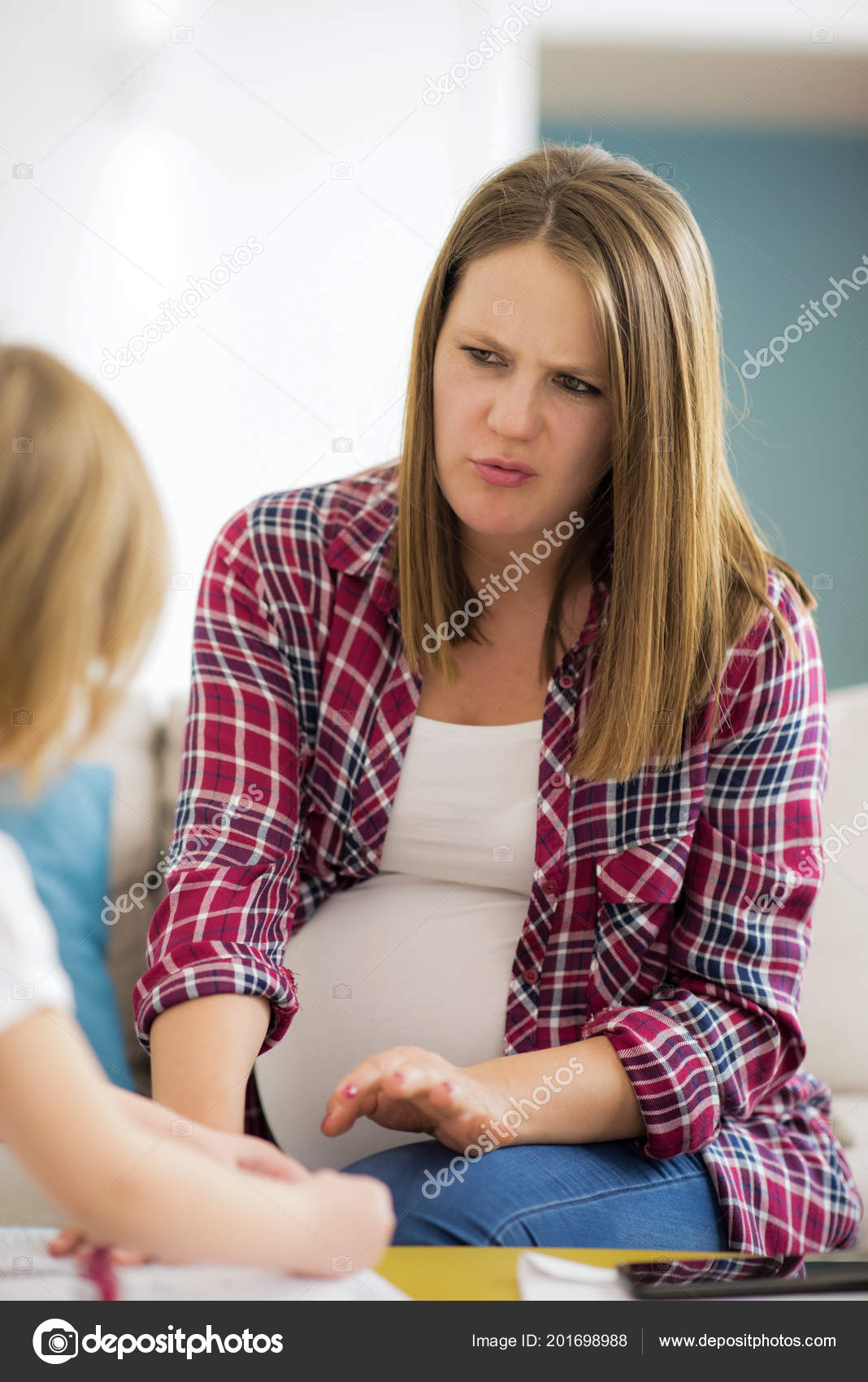 Little Cute Daughter Painting Nails Her Pregnant Mom While