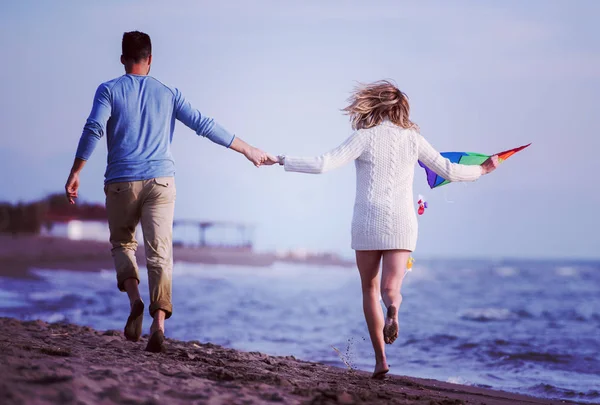 Young Couple Having Fun Playing Kite Beach Autumn Day Filter — Stock Photo, Image