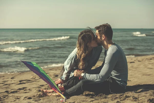 Young Couple Having Fun Playing Kite Beach Autumn Day Filter — Stock Photo, Image