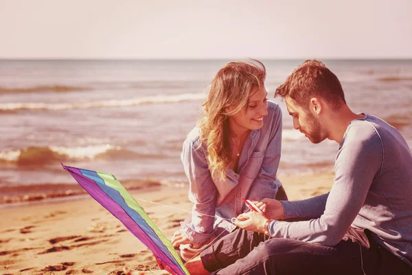 Young Couple Having Fun Playing Kite Beach Autumn Day Filter — Stock Photo, Image