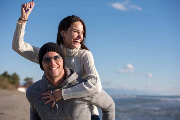 Man Giving Piggy Back Rides Sunset Sea Autumn Time — Stock Photo, Image