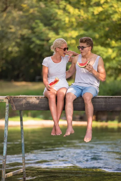 Couple Love Enjoying Watermelon While Sitting Wooden Bridge River Beautiful — Stock Photo, Image