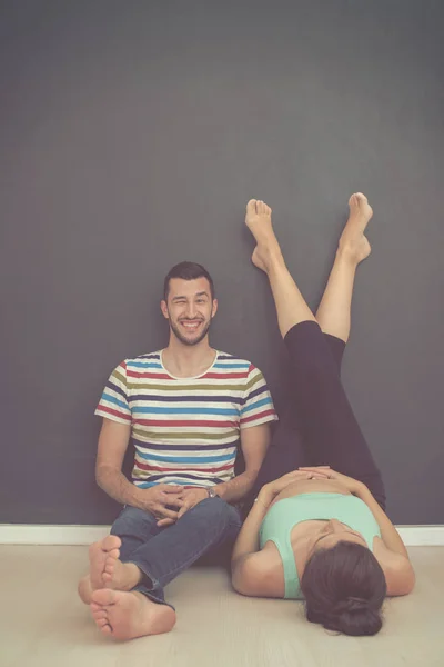 Happy Pregnant Couple Relaxing Front Black Chalkboard Floor Home — Stock Photo, Image