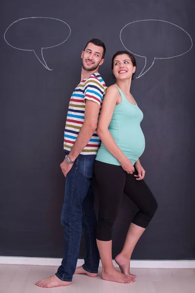 Young Pregnant Couple Thinking Names Unborn Baby Writing Them Black — Stock Photo, Image