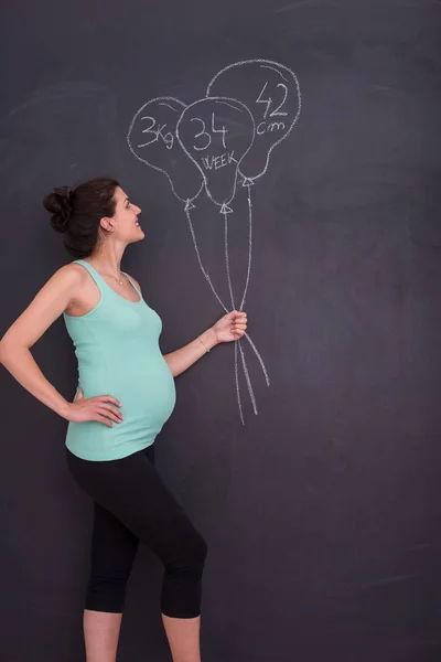 Portrait Happy Pregnant Woman Hands Belly Front Black Chalkboard — Stock Photo, Image