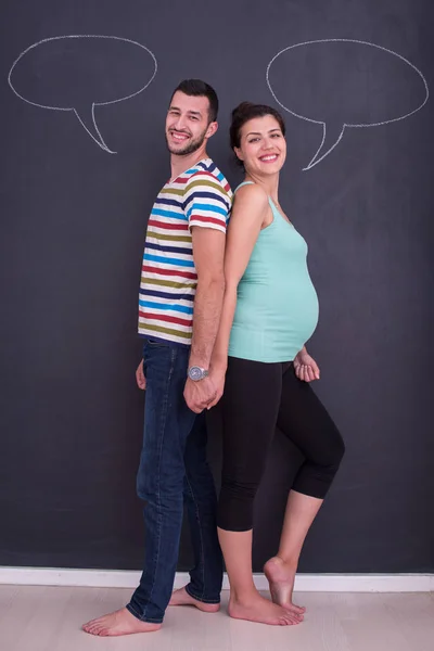 Young Pregnant Couple Thinking Names Unborn Baby Writing Them Black — Stock Photo, Image