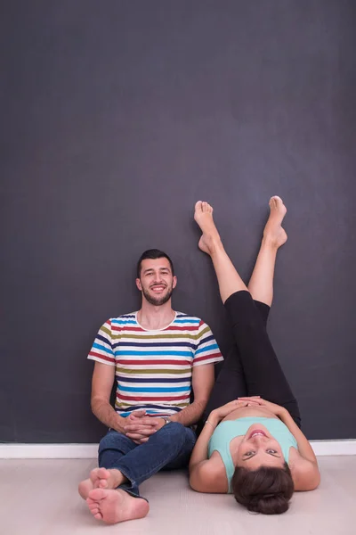 Happy Pregnant Couple Relaxing Front Black Chalkboard Floor Home — Stock Photo, Image