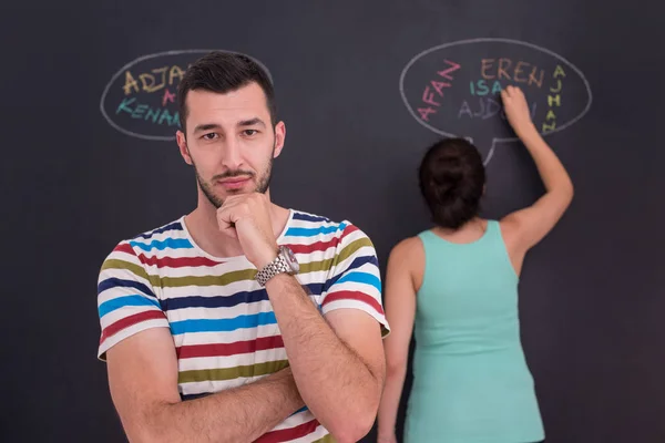 Young Pregnant Couple Thinking Names Unborn Baby Writing Them Black — Stock Photo, Image