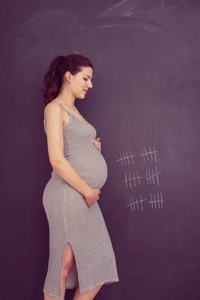 Portrait Happy Pregnant Woman Hands Belly Front Black Chalkboard — Stock Photo, Image