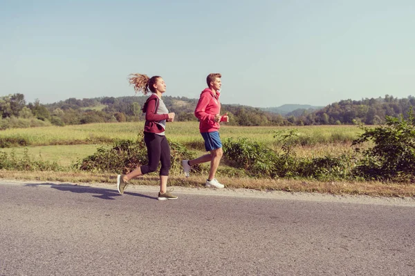 Young Couple Enjoying Healthy Lifestyle While Jogging Country Road Exercise — Stock Photo, Image