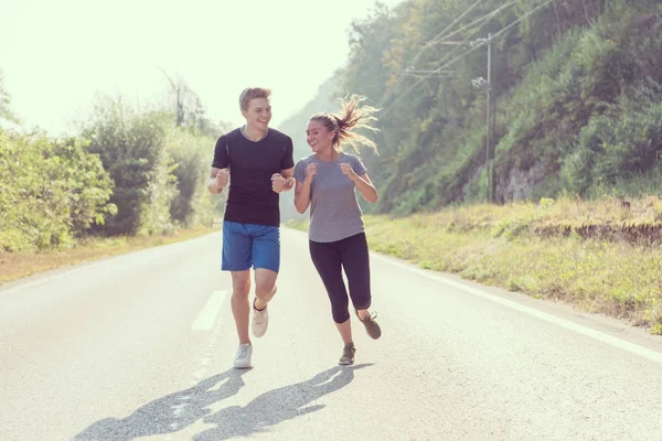 Young Couple Enjoying Healthy Lifestyle While Jogging Country Road Exercise — Stock Photo, Image