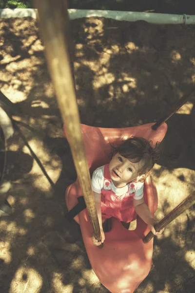 Cheerful Smiling Cute Little Girl Having Fun While Swinging Playground — Stock Photo, Image