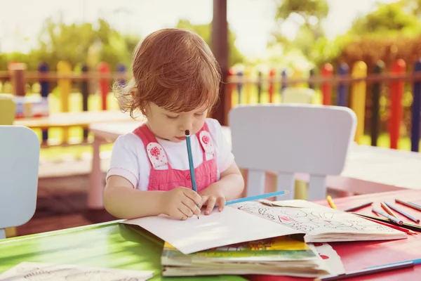 Cute Little Girl Cheerfully Spending Time Using Pencil Crayons While — Stock Photo, Image