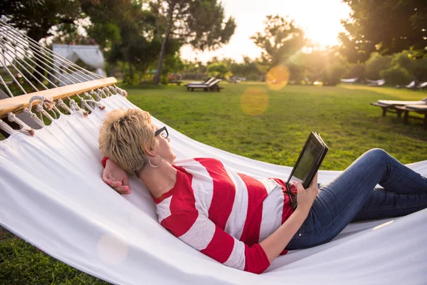 Young Woman Using Tablet Computer While Relaxing Hammock Peaceful Garden — Stock Photo, Image