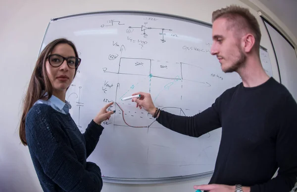 Two Young Male Female Students Writing White Chalkboard Math Class — Stock Photo, Image
