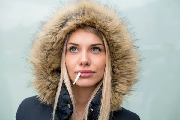 Portrait Young Blonde Girl Wearing Winter Jacket Hood Cigarette Mouth — Stock Photo, Image