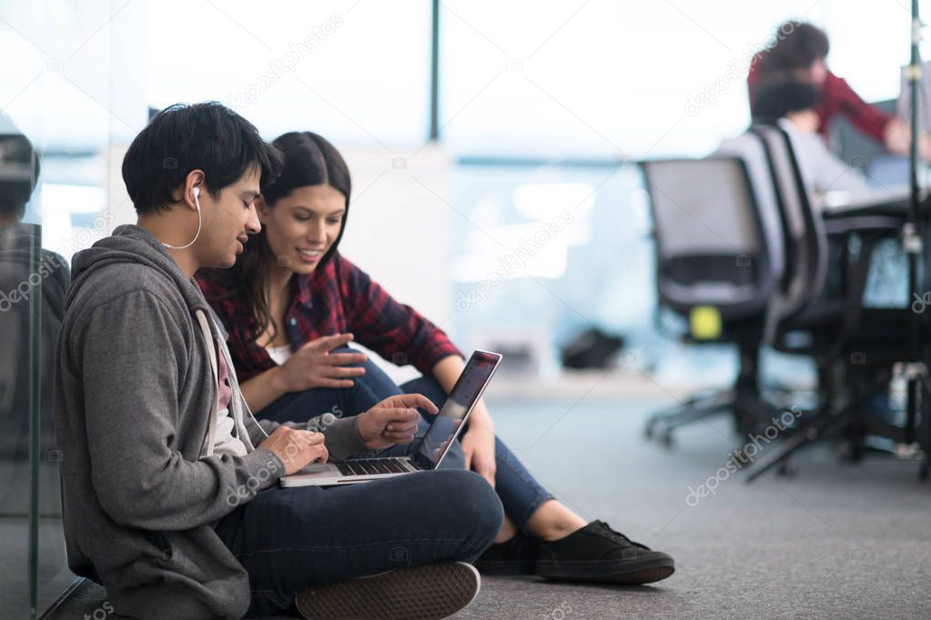 software developers couple working on the floor