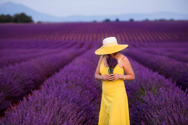Asian woman in yellow dress and hat at lavender field — Stock Photo, Image