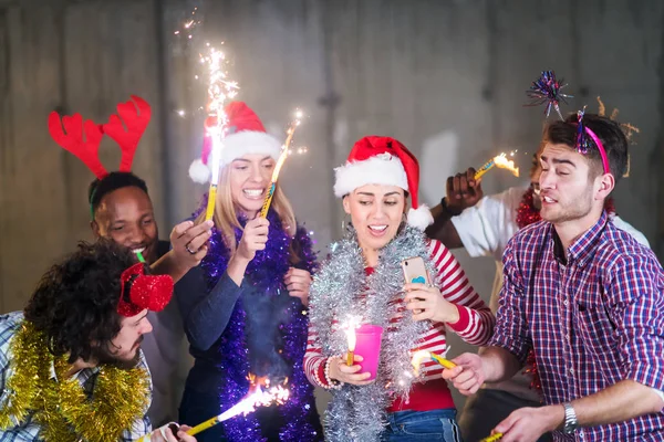 Multiethnic group of casual business people dancing with sparkle — Stock Photo, Image