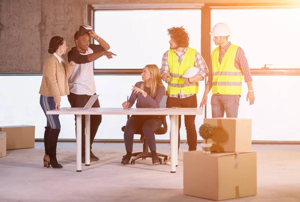 Group of multiethnic business people on construction site — Stock Photo, Image