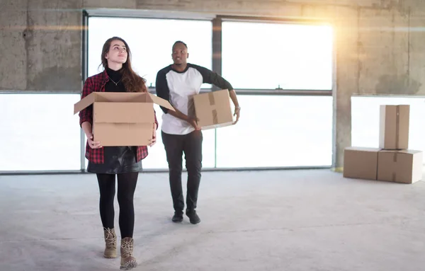 Multiethnic business team carrying cardboard boxes — Stock Photo, Image