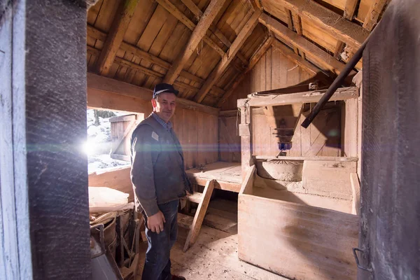 Portrait of a miller in retro wooden watermill — Stock Photo, Image