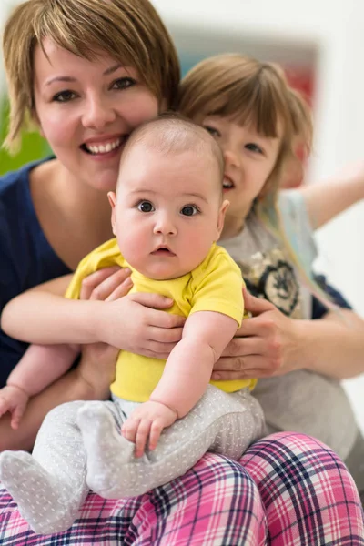 Portrait of young mother with  her kids — Stock Photo, Image