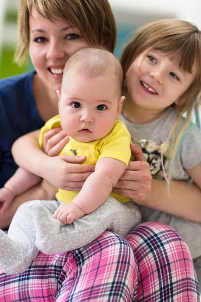 Portrait of young mother with  her kids — Stock Photo, Image