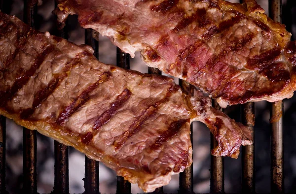 Delicious grilled meat on barbecue — Stock Photo, Image